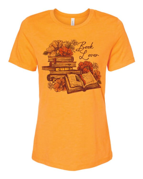 The Book Lover T Shirt, lovingly crafted on a BELLA + CANVAS - Women’s Relaxed Fit Heather shirt in the warm hue of Heather Marmalade, pays homage to this profound love for literature.